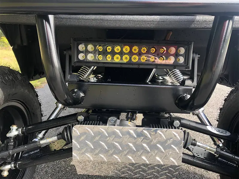 Golf cart undergoing front suspension repair